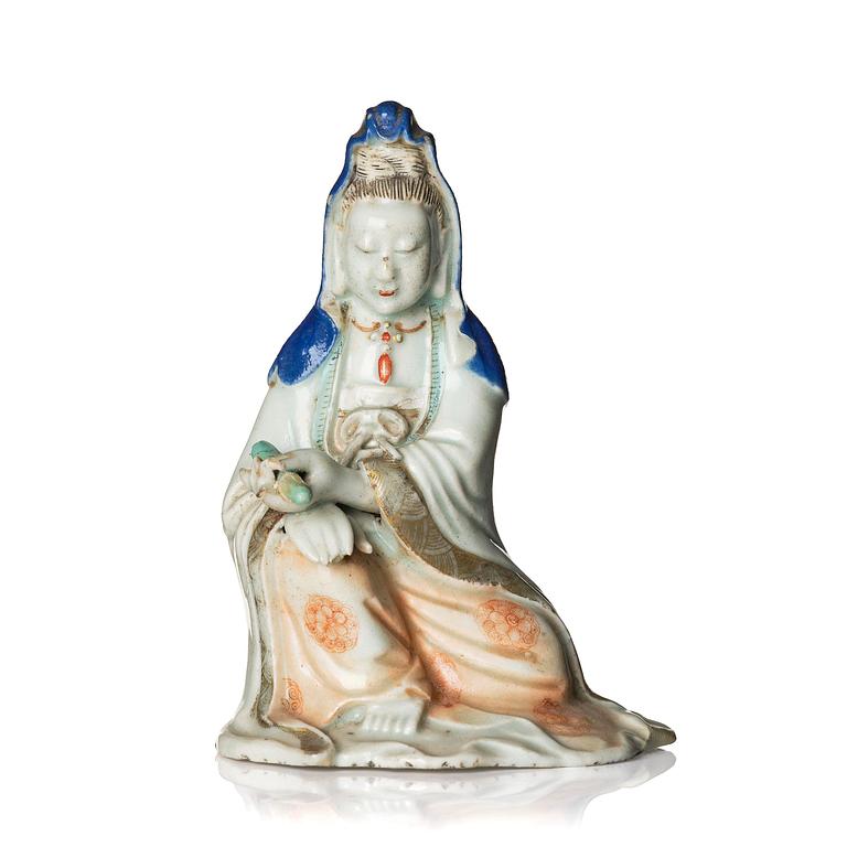 A porcelain figure of Guanyin, Qing dynasty, (1736-95).