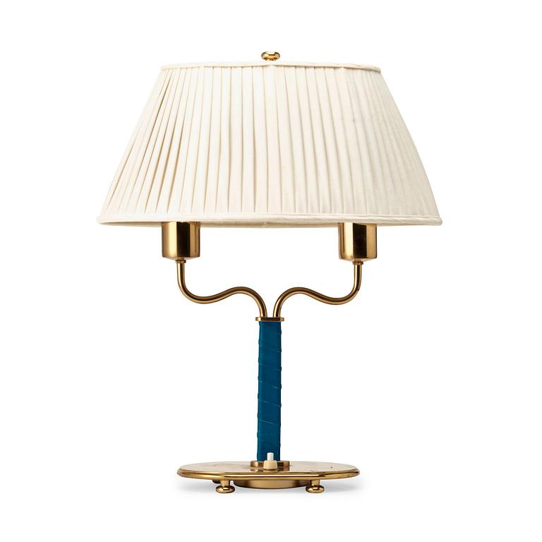 Josef Frank, a brass and blue leather table lamp, Svenskt Tenn, Sweden, model 2388.