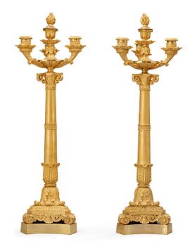 756. A pair of French Empire early 19th century four-light candelabra.
