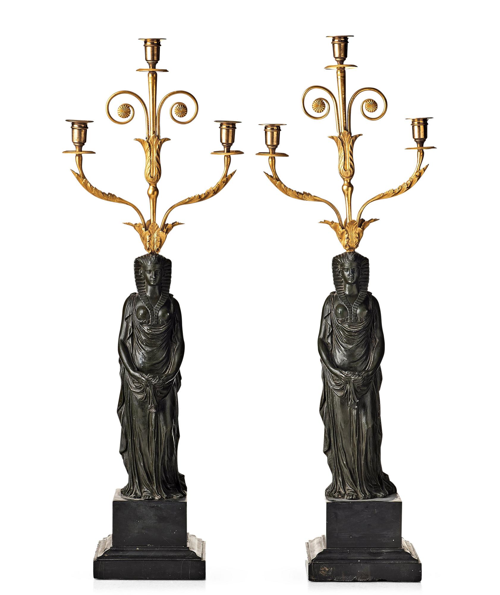 A pair of French Empire early 19th century three-light candelabra.