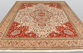 A carpet, Figural Tabriz, so called,  Tabatabai, 380 x 282 cm.