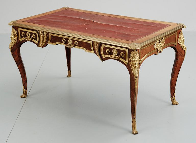 A Louis XV-style writing desk, circa 1900.