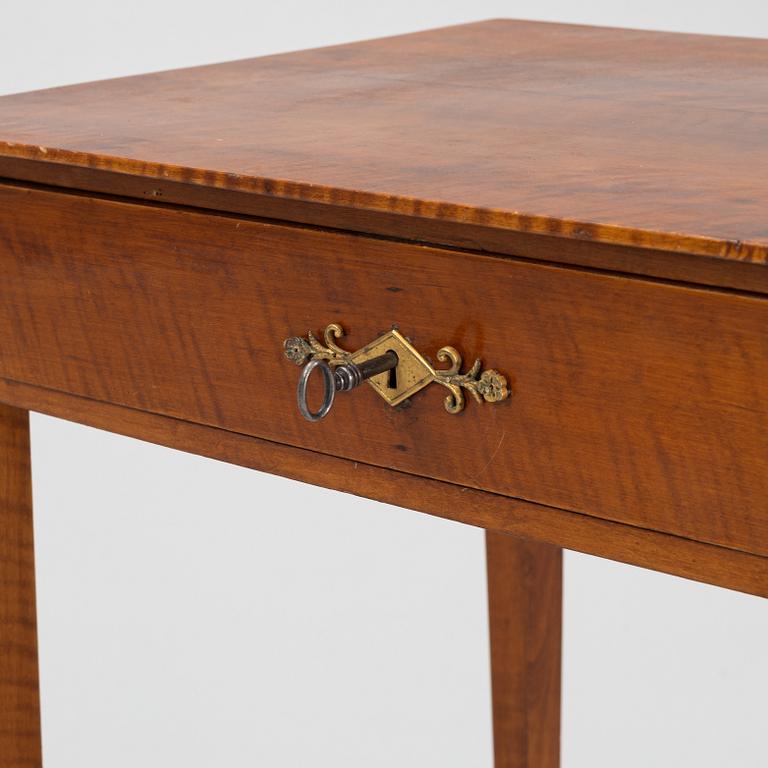 A Swedish Empire mahogany table, early 19th century.