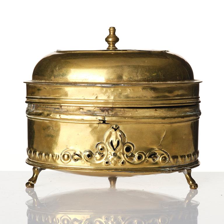 A baroque repousse brass pyxis, 18th century.