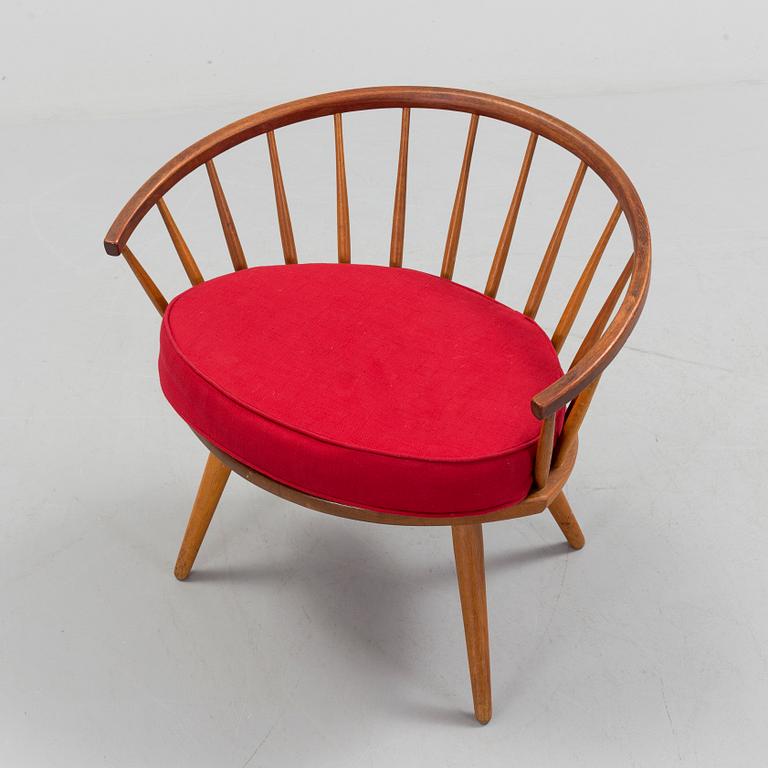 A teak 'Arka' armchair.