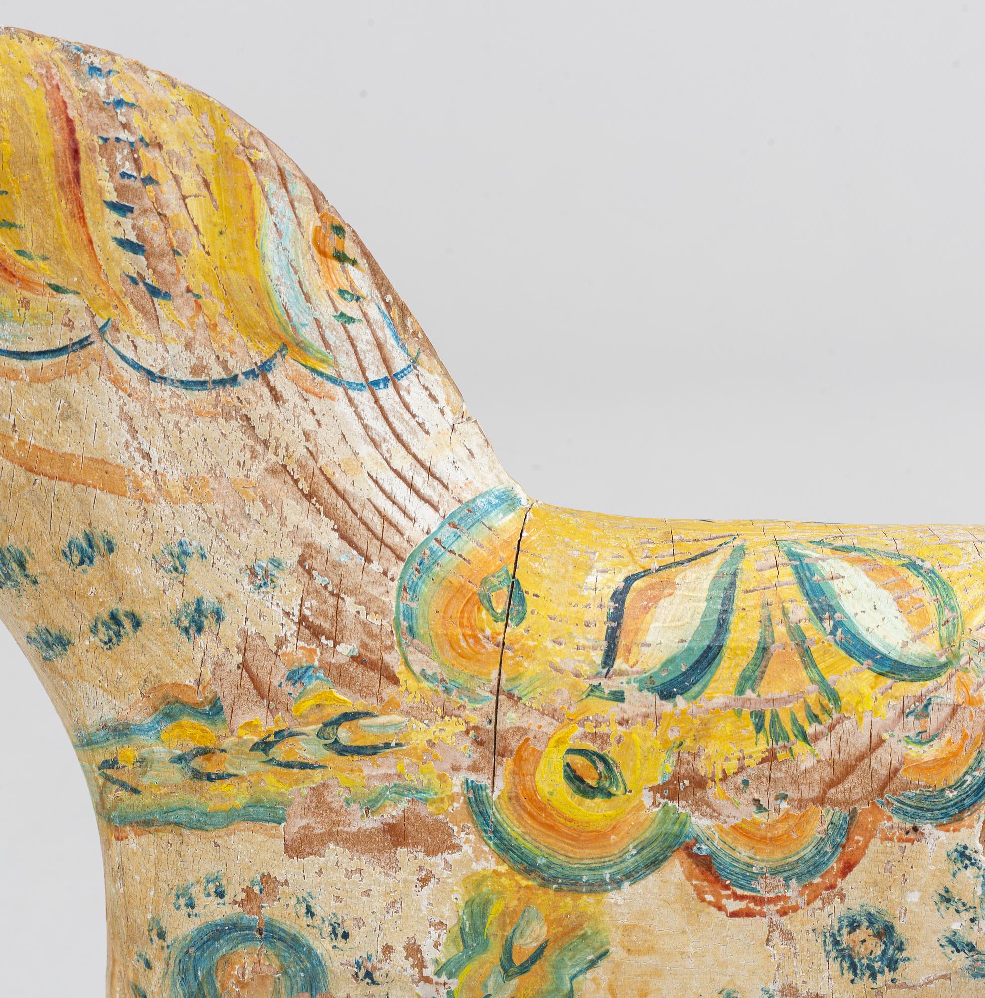 A painted Swedish wooden horse from the first half of the 20th century.