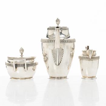 A silver coffee pot, creamer and sugar bowl, import marks of Axel Larson, Helsingborg 1920.