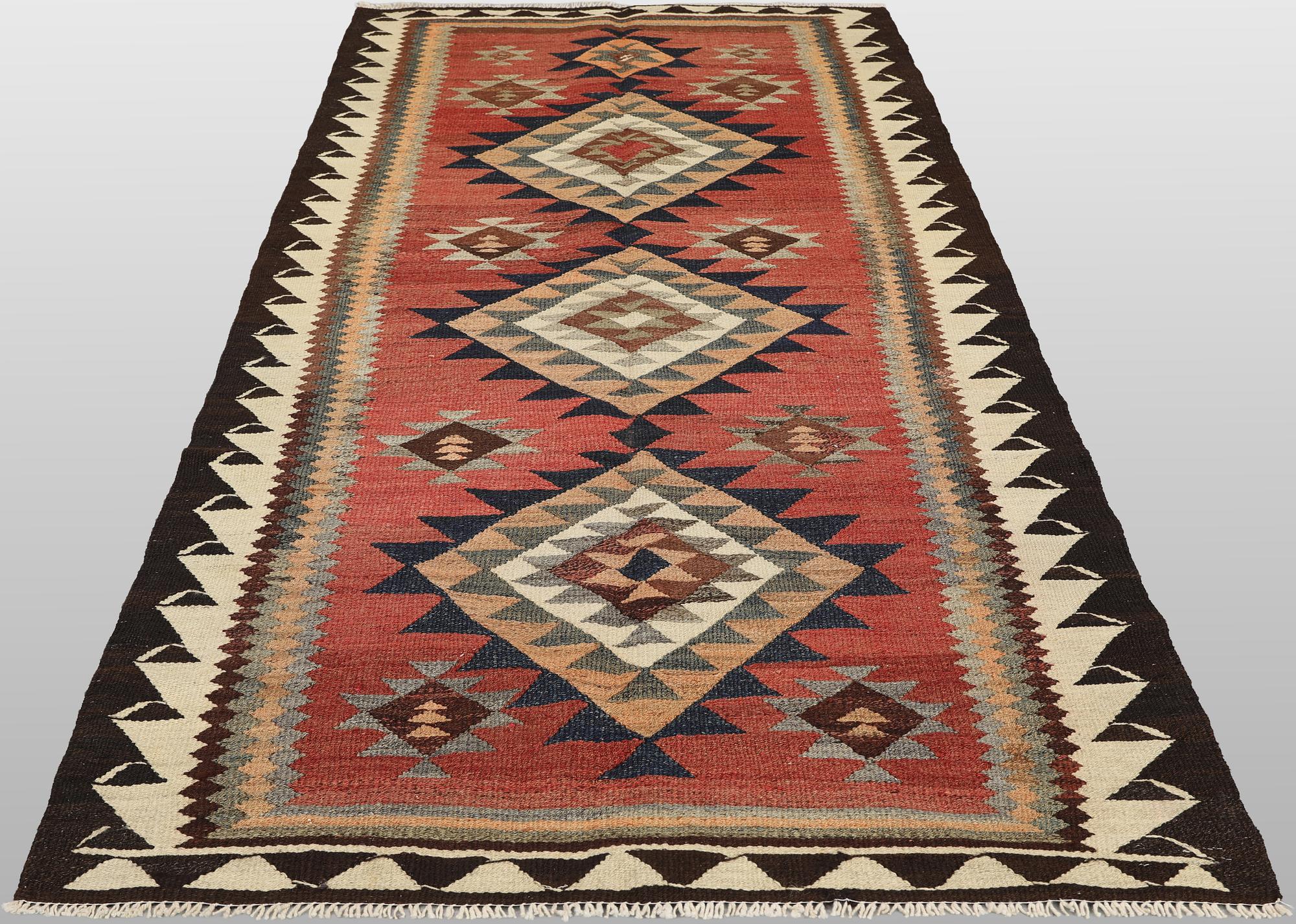 A Nomad Kurdish kilim rug, 270 x 132 cm.