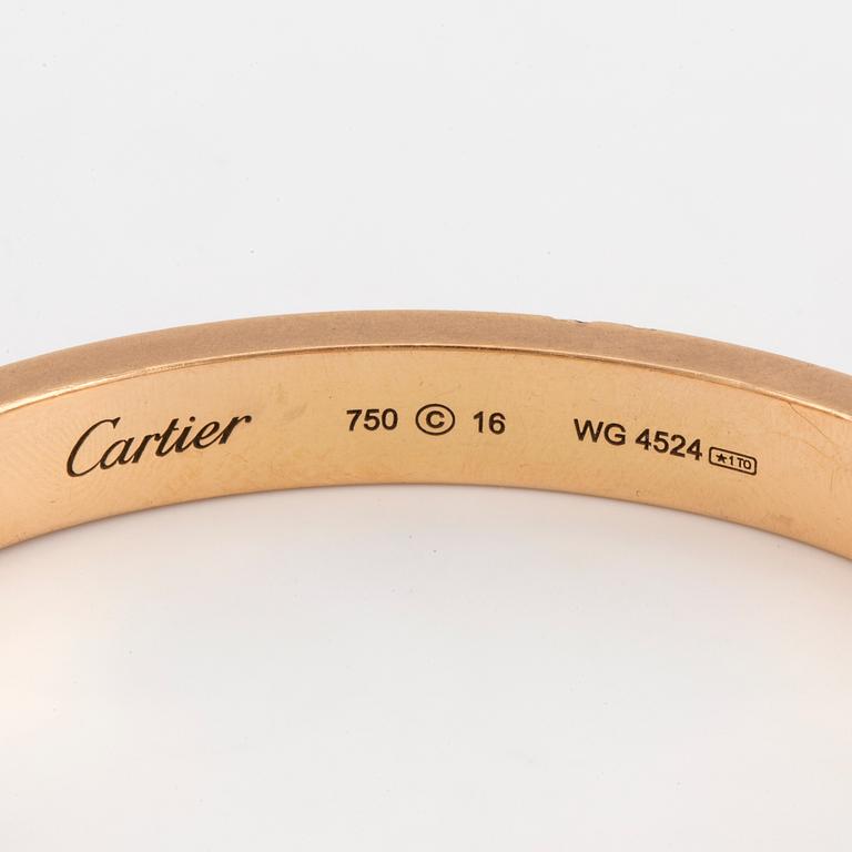 A Cartier 'LOVE' bangle set with round, brilliant-cut diamonds.