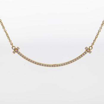 Tiffany & Co, an 18K gold 'T Smile' necklace,  with brilliant-cut diamonds.