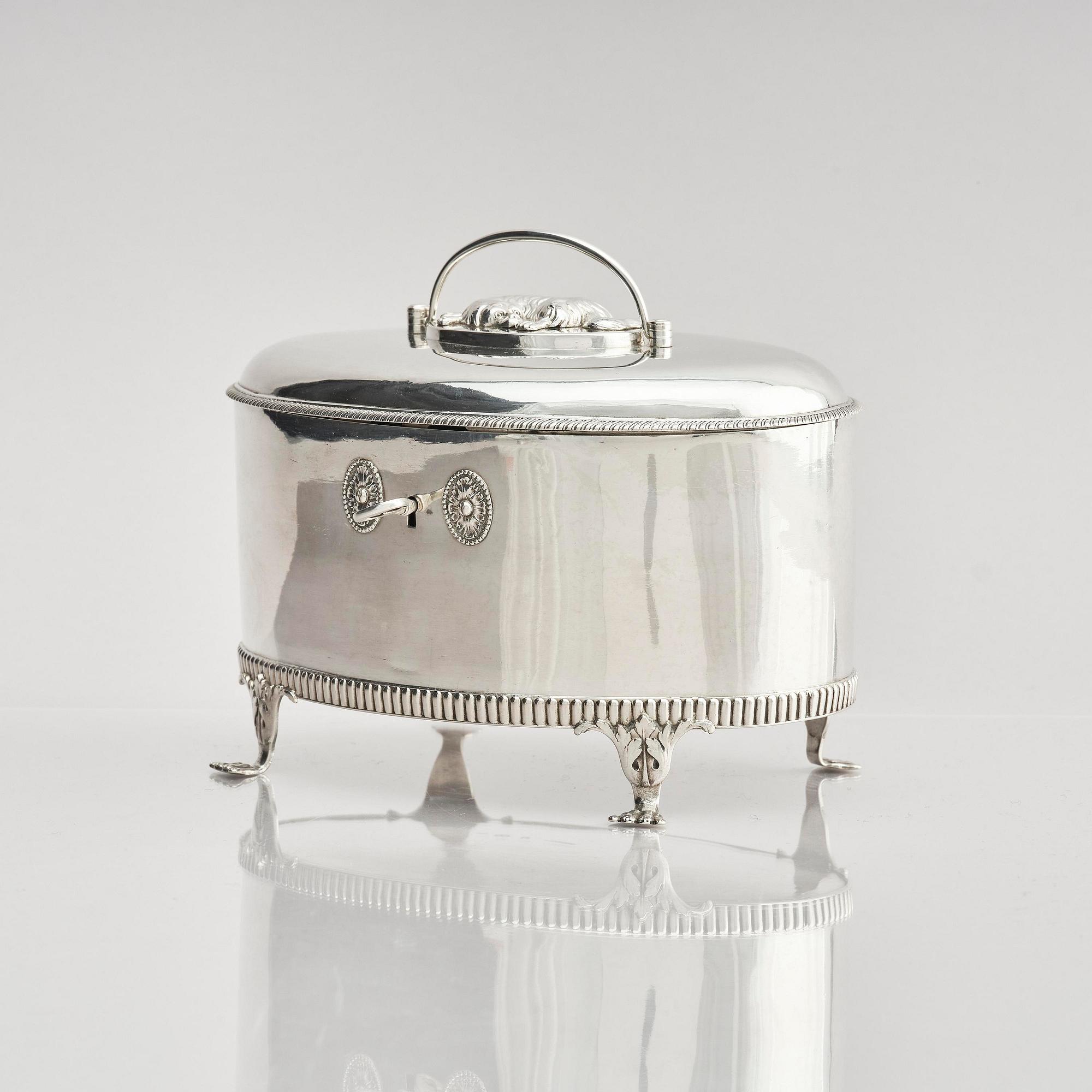 A Swedish 19th century silver sugar-casket and tong, marks of Adolf Zethelius, Stockholm 1819.