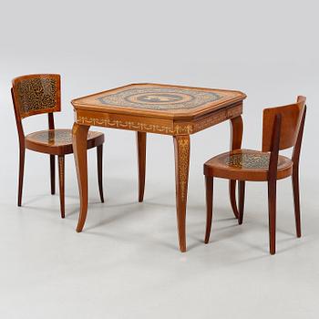 A gaming table and two chairs from Italy, 1950s.