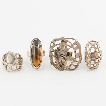 Lars Arby, four rings, silver, one with tiger's eye.