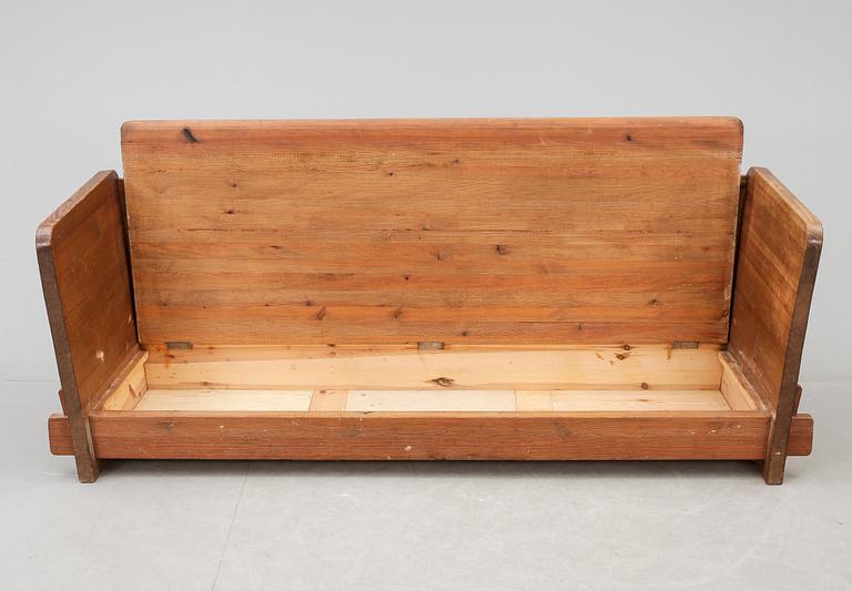 An Axel Einar Hjorth 'Lovö' stained pine sofa, Nordiska Kompaniet, Sweden 1930's.