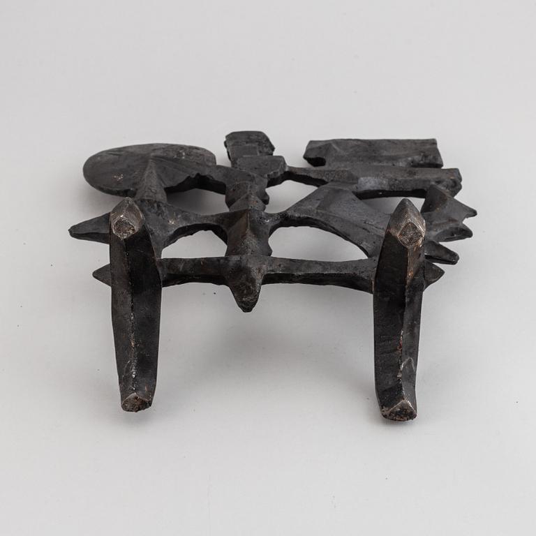 OLLE HERMANSSON, a cast iron sculpture, marked Husqvarna.