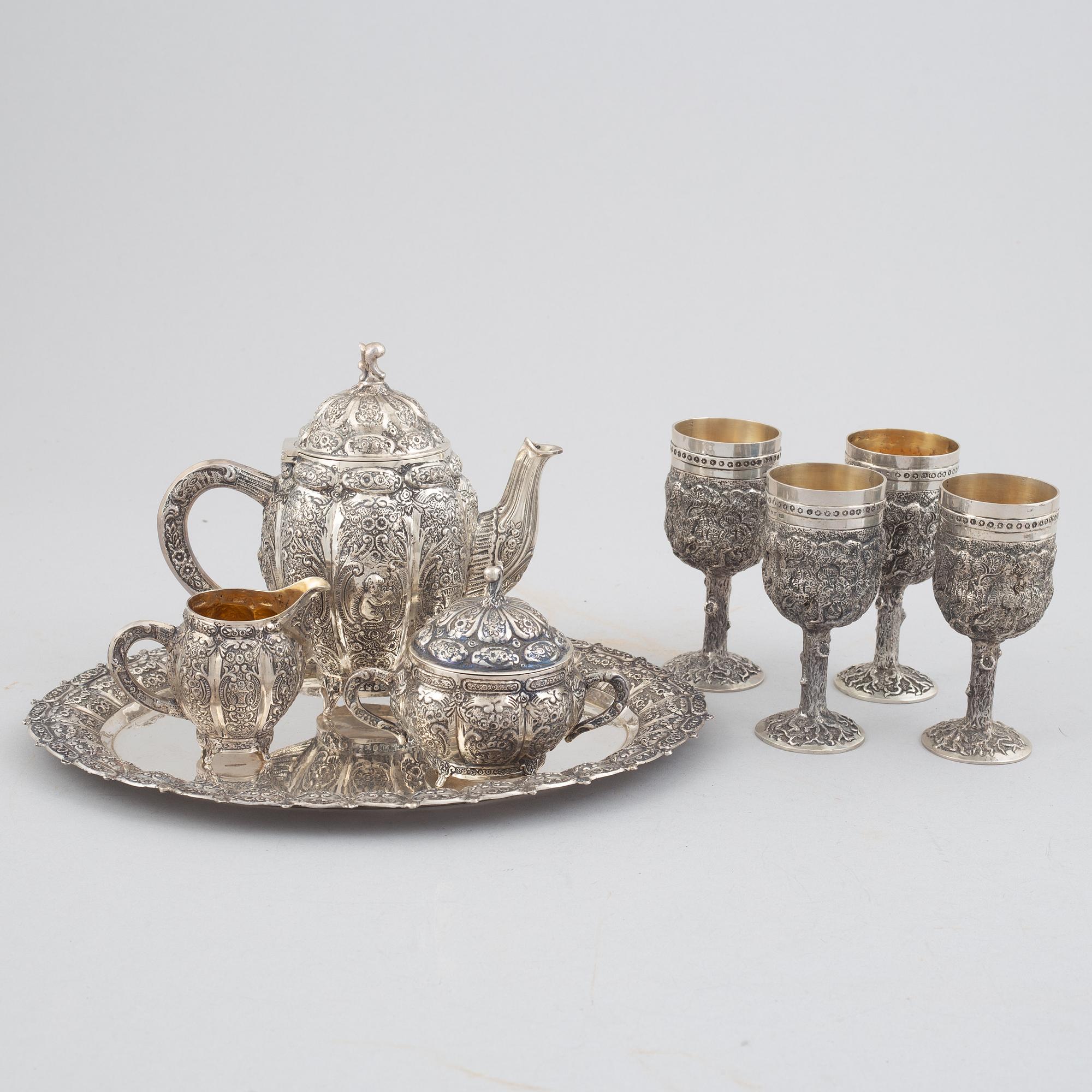 E.Jäntti, four silver cups, a three-piece silver coffee service and a silver tray, Helsinki, Finland,1979-81.