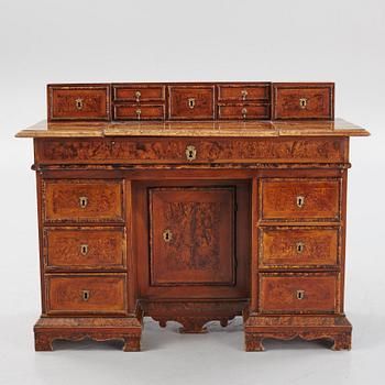 A Swedish late Baroque alder-veneered 'knee-hole' writing desk, first part of the 18th century.