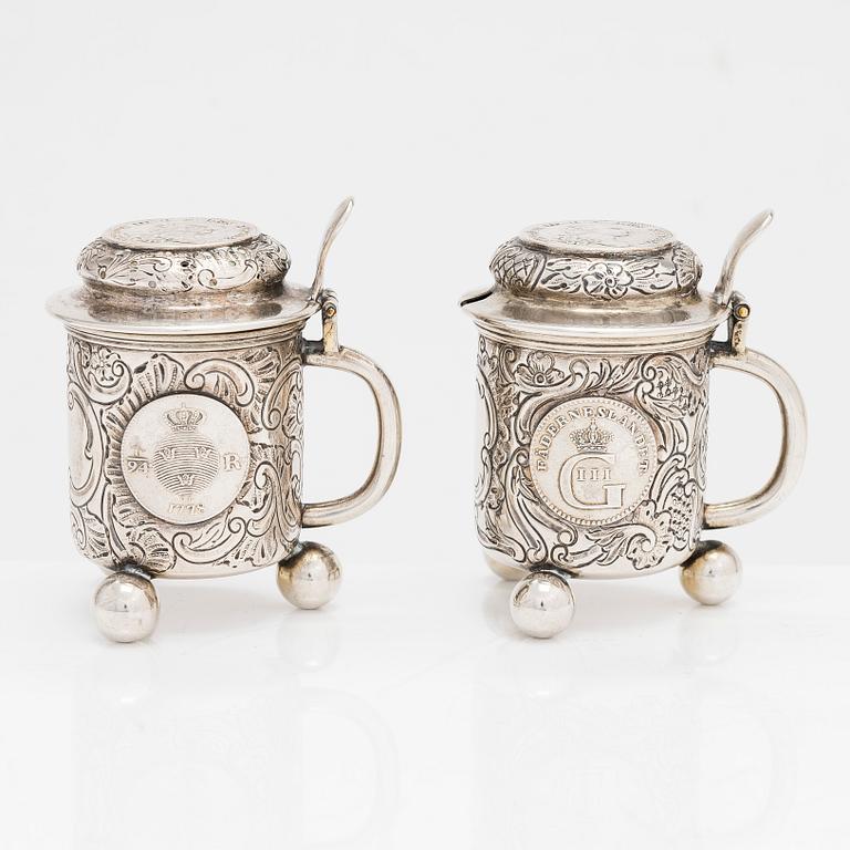 A pair of silver salt and mustard tankard,  C.G. Hallberg, Stockholm 1911 and 1914.
