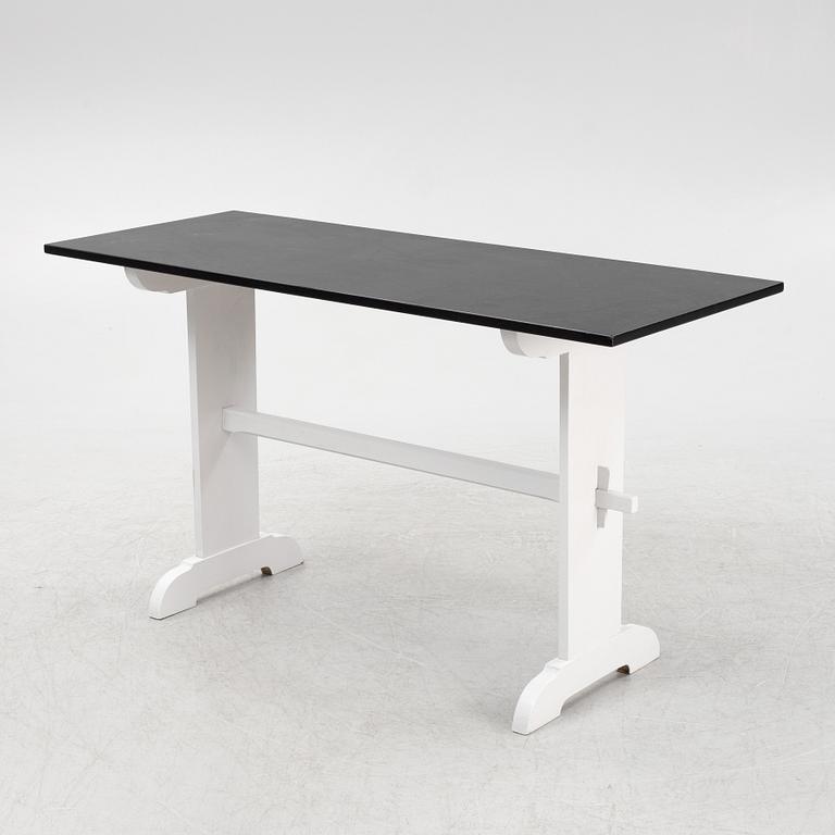 A painted table, 20th Century.