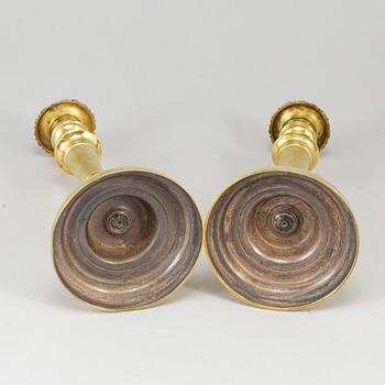 A pair of bronze candlesticks, first half of the 19th century.