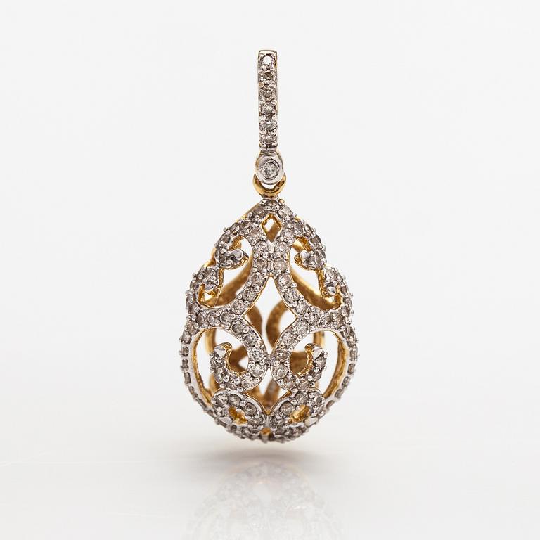 A 14K gold egg-shaped pendant with diamonds ca. 0.53 ct in total. With IGI certificate number.