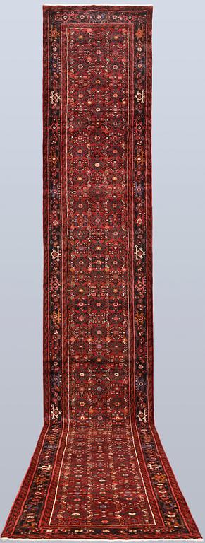 A Hosseinabad runner, c. 590 x 90 cm.