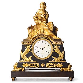 131. A French Empire mantel clock, early 19th century.