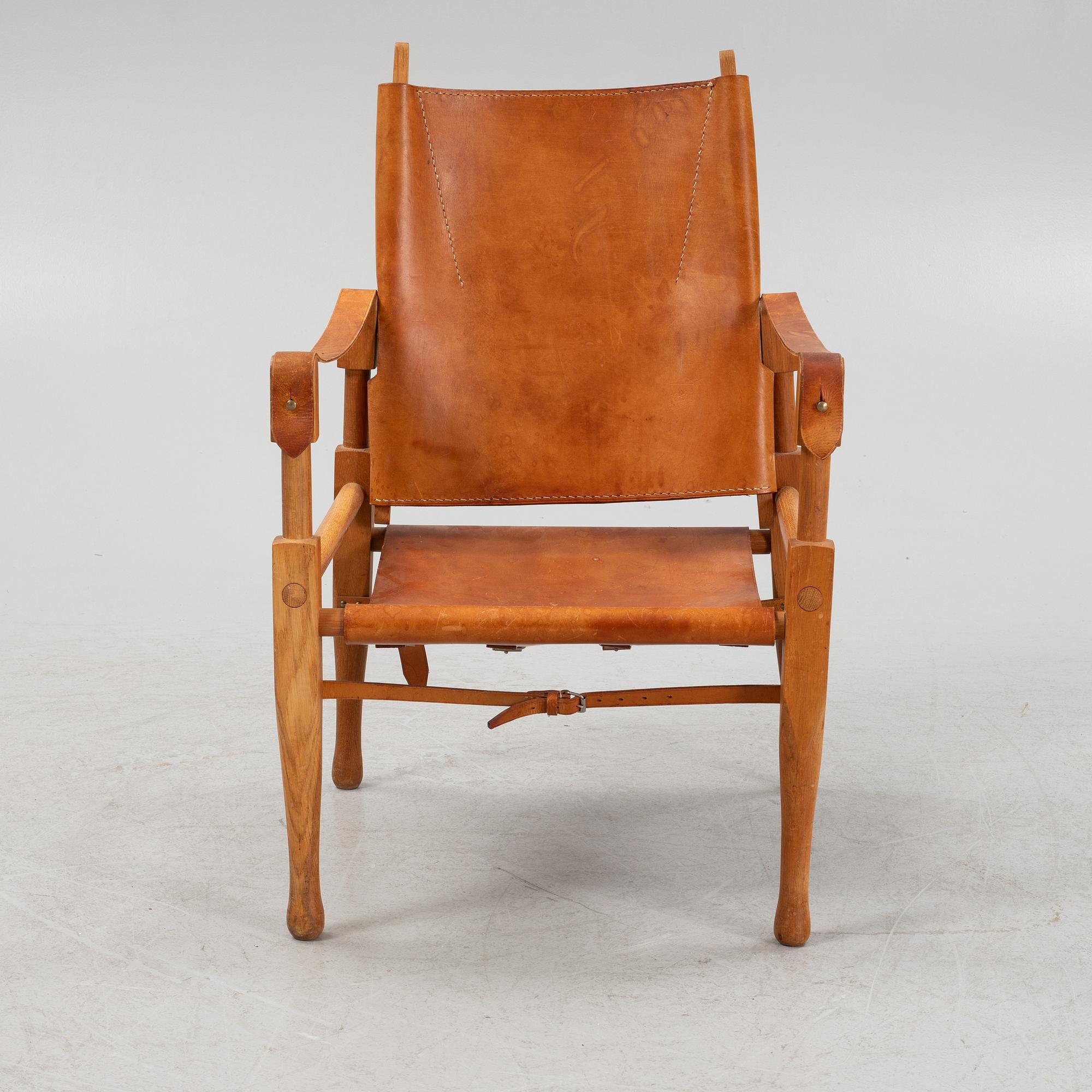 Scandianvian Modern, an oak and leather easy chair, mid 20th Century.