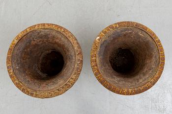 A pair of cast iron garden urns fist half of the 20th century.