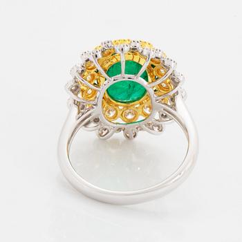 Cabochon-cut emerald and brilliant-cut diamond ring.