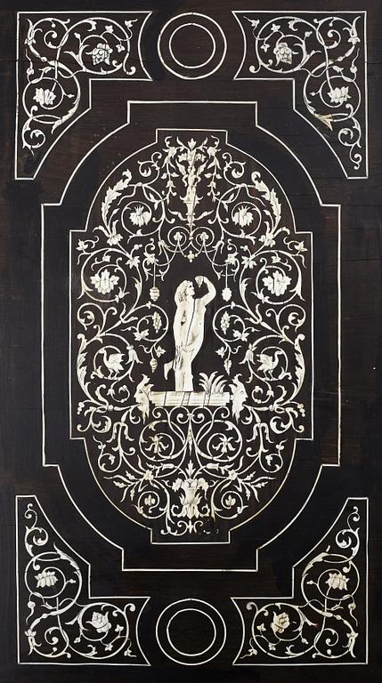 A Renaissance-style ebony, ebonized and ivory-inlaid library table, late 19th century, presumably Germany.