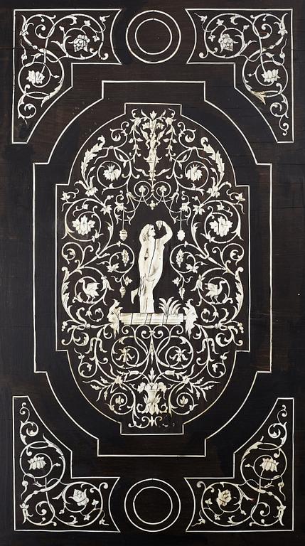 A Renaissance-style ebony, ebonized and ivory-inlaid library table, late 19th century, presumably Germany.