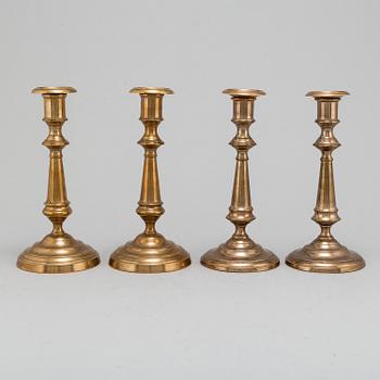 Four (2+2) brass candle holders, including Skultuna.