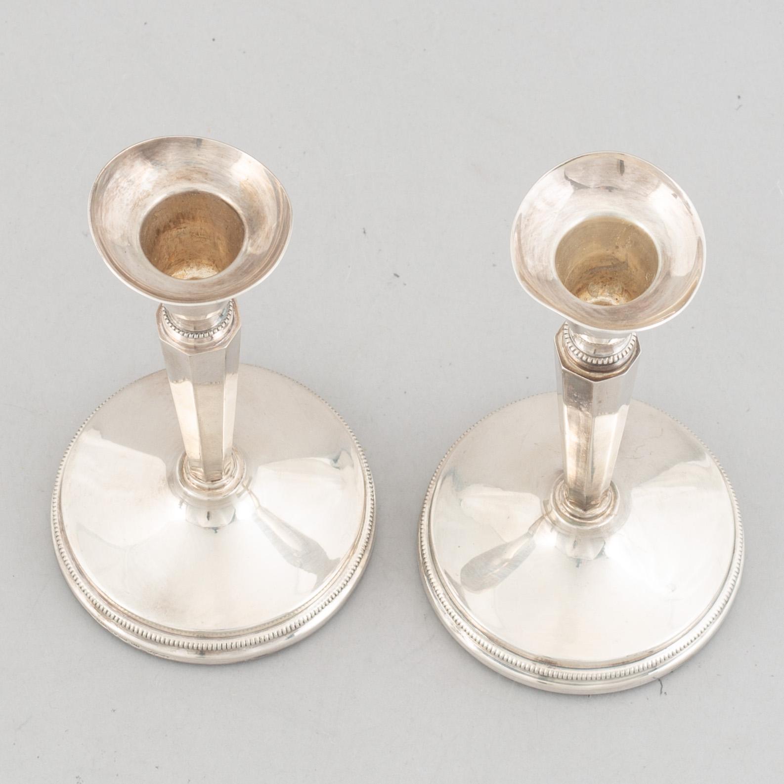 Two pairs of Swedish silver candlesticks, including Eric Löfman, MGAB, Uppsala 1979-1982.
