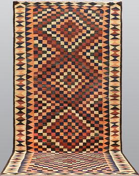 A kilim carpet, ca 333 x 163 cm.