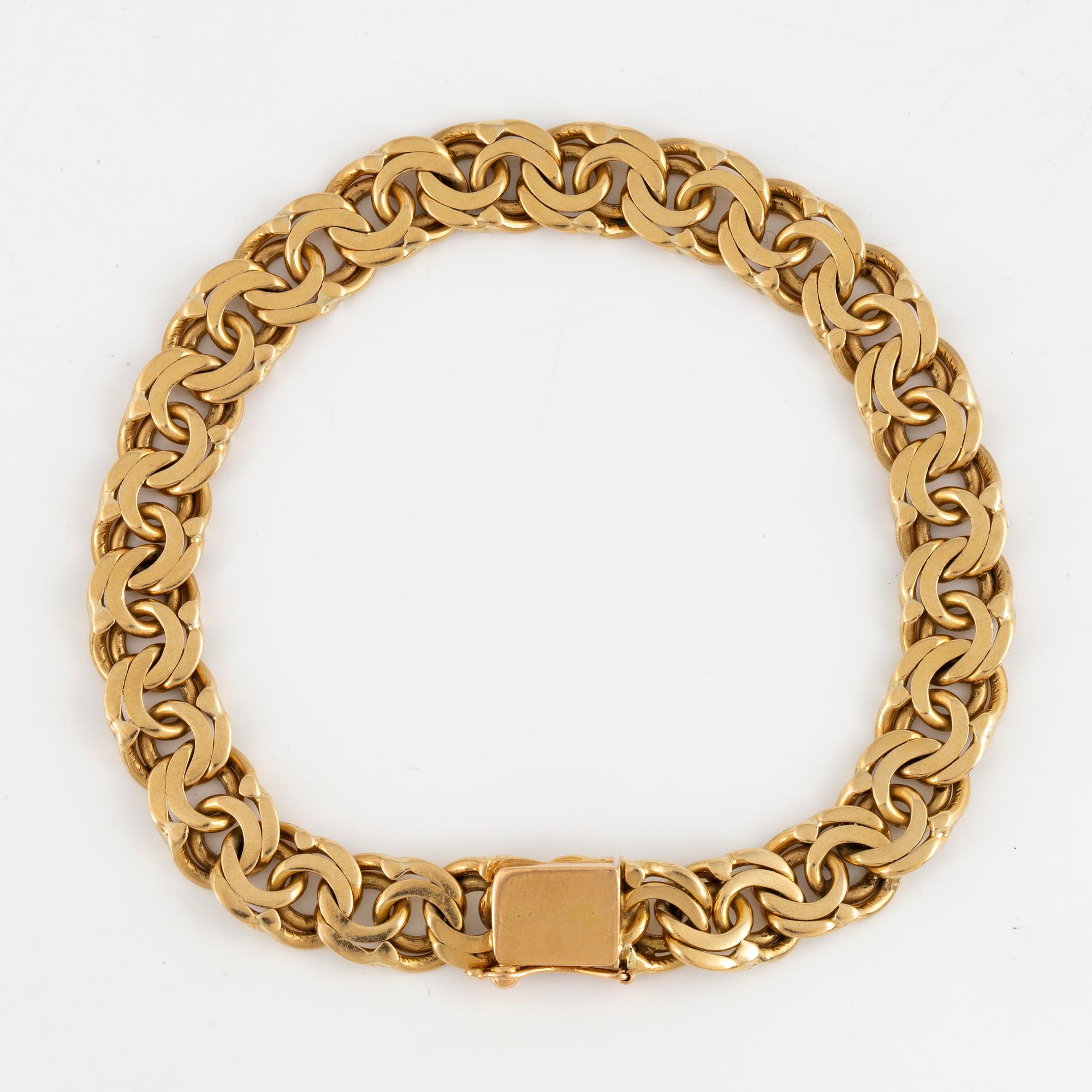 An 18K gold bracelet.
