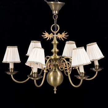 A 20th century baroque style brass ceiling light.