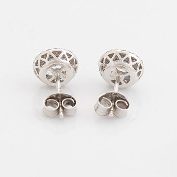 Blue topaz and brilliant cut diamond earrings and necklace.