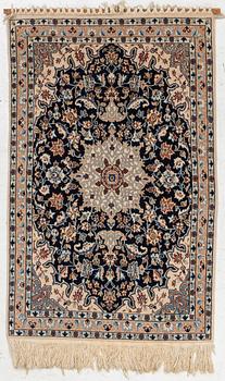 A Nain rug, part silk, c. 128 x 82 cm.