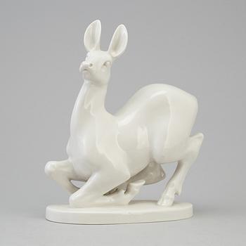 A Russian white glazed figurine of a deer, Lomonosov, St Petersburg, 1960/70's.