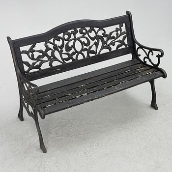 A garden bench, late 20th century.