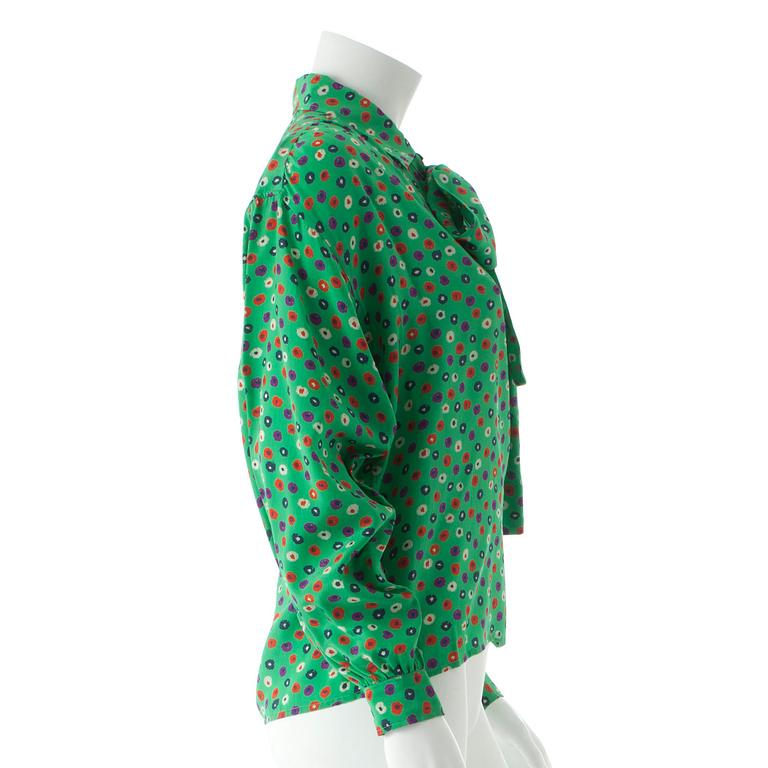 YVES SAINT LAURENT, a green silk blouse.