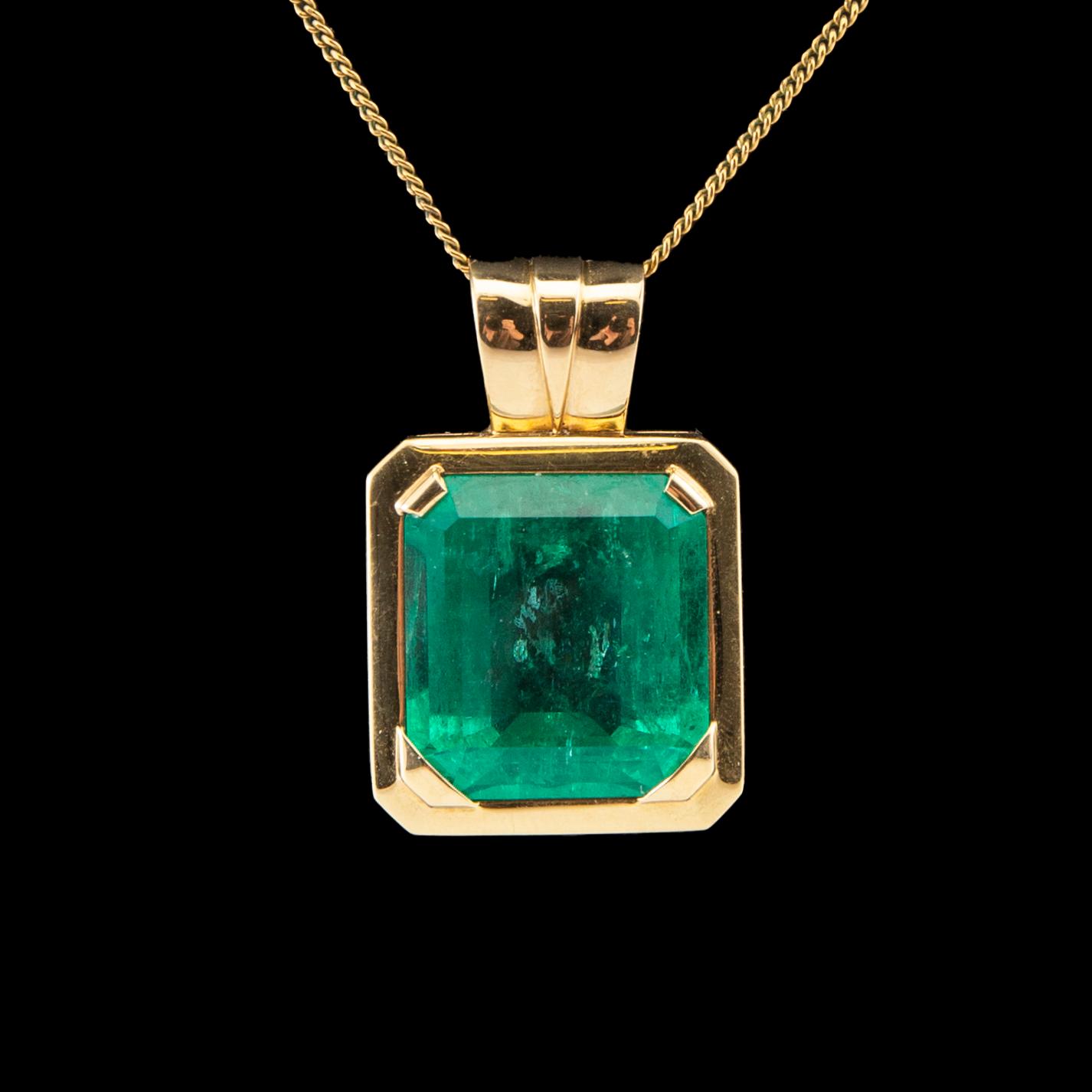 An 18K gold pendant set with an emerald-cut emerald, Schrittesser Gold & Silversmith Gothenburg.