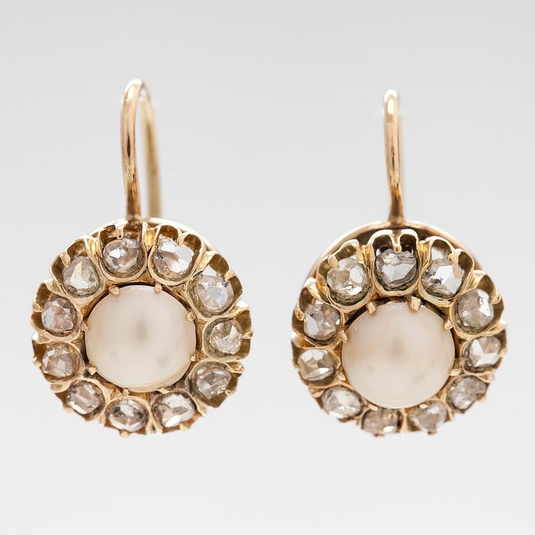 A pair of 14K gold earrings with cultured halfpearls and rose-cut diamonds.