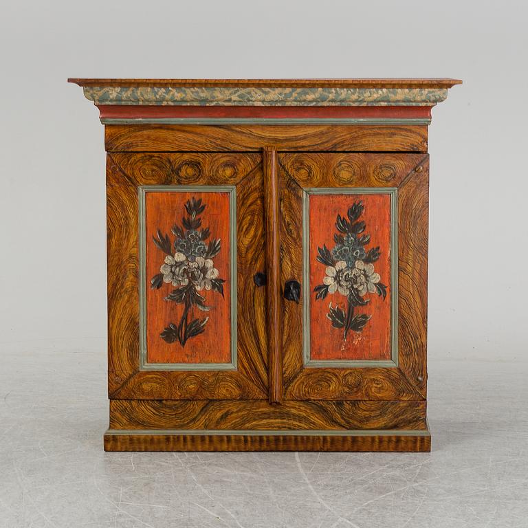 A 18/19th Century painted cabinet.