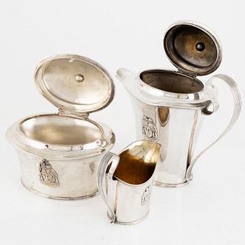 A Swedish silver coffee pot, a sugarbox and a creamer, including Gustaf Hamnqvist, Åmål 1809.