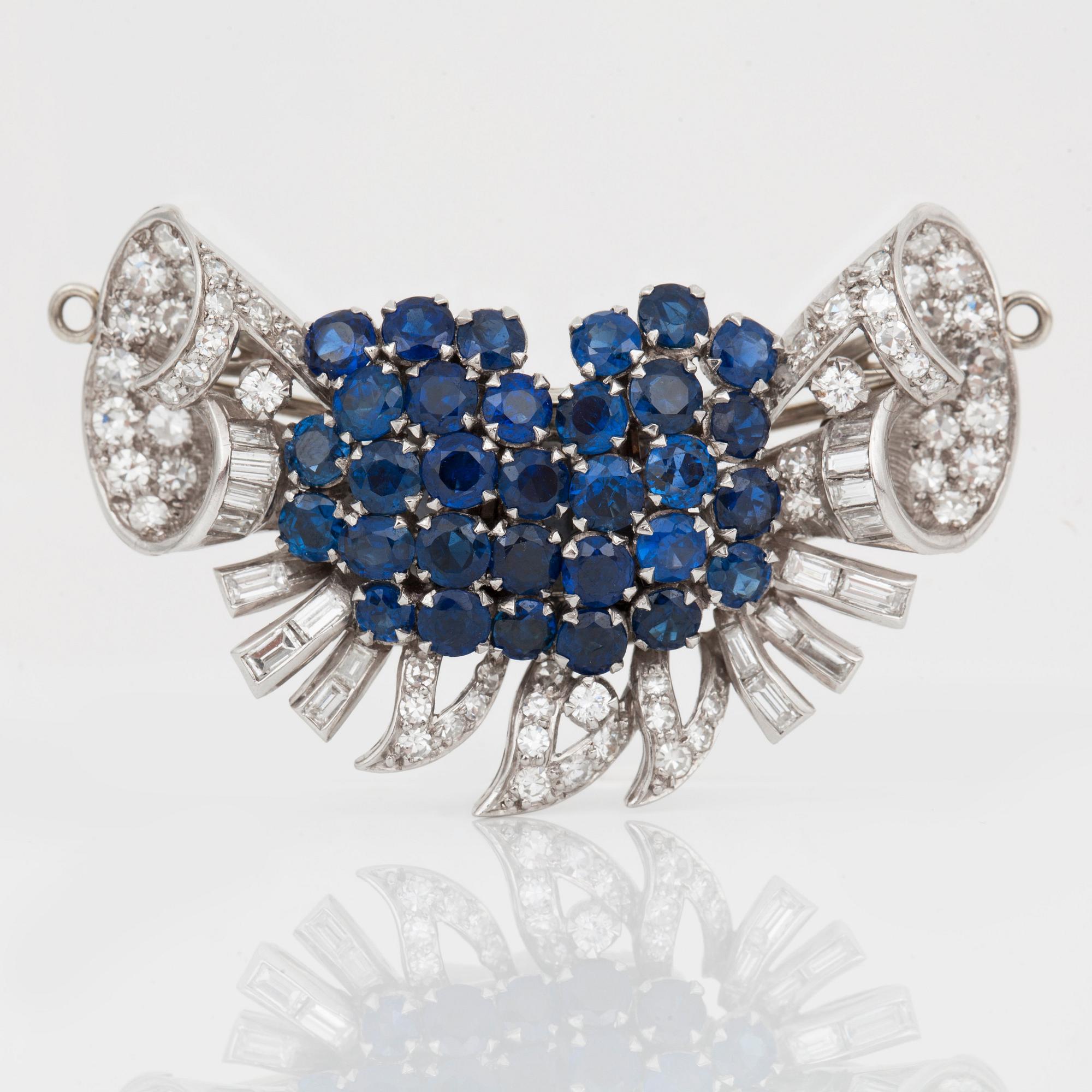 A diamond and sapphire set, probably Garrard & co. The set can be worn as a necklace, earrings, double clip or brooch.