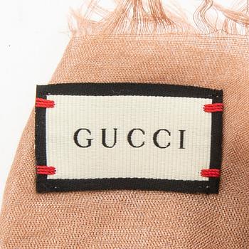Gucci, belt and shawl.