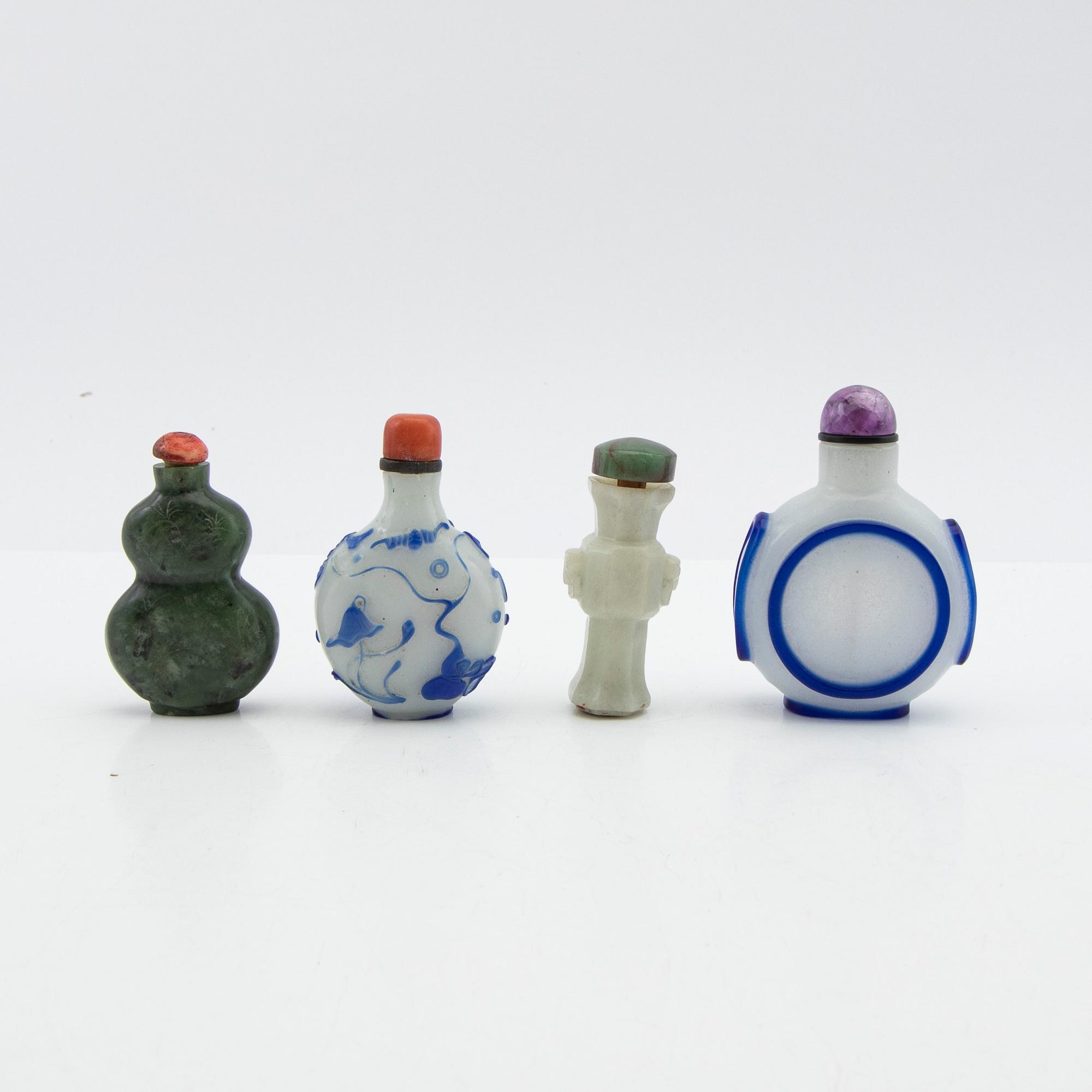 Snuff bottles, four pieces of Peking glass and stone. China, 20th century.