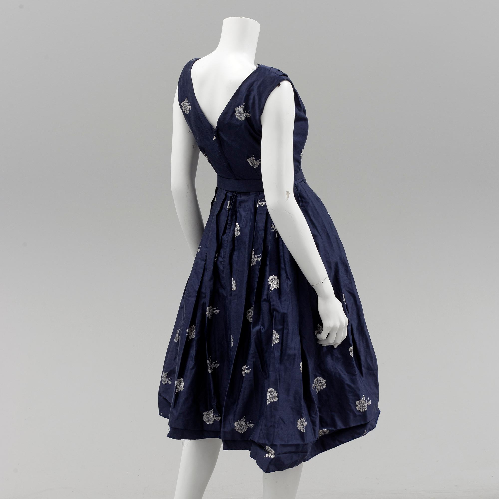 A Christian Dior 1950s midnight blue cocktail dress.